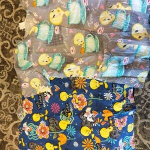 Lot of two Looney Toons scrub tops size xs.